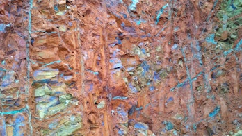 the photo depicts a not focused on the surface of nickel ore saprolite in open pit mines