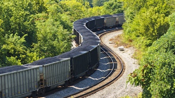 Photograph of a coal train through a forest