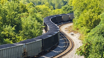 Photograph of a coal train through a forest