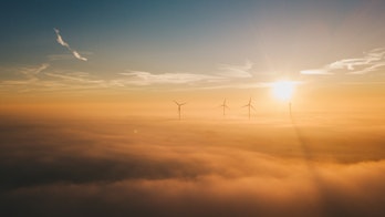 Photo Showing A Group Of Windmills Above Clouds By Sander Weeteling N64qxlfs2qg Unsplash