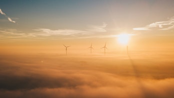 Photo Showing A Group Of Windmills Above Clouds By Sander Weeteling N64qxlfs2qg Unsplash