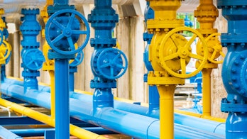 Photo Showing Blue And Yellow Pipelines Valves At Gas Plant Shutterstock 1921909664