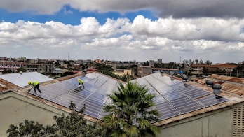 Photo depicts roof mounted solar power plant on a factory roof in Kenya in Africa