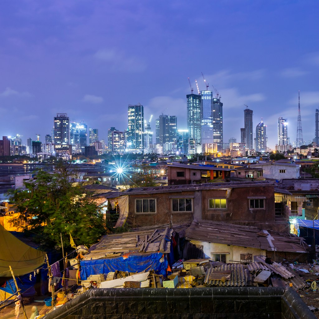Photo depicts Night skyline of Mumbai photographed from Worli fort with the village in the foreground. Encroachment and development in the same frame.