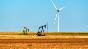 Photo depicts green and fossil energy production