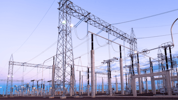 Cover of Electricity Market Report 2023 - A photograph of a power plant at sunrise